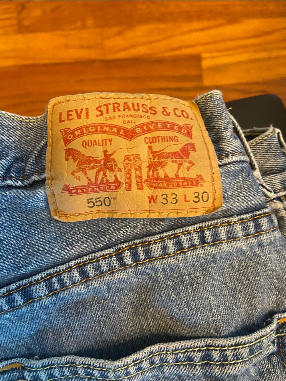 Levi's 550 Relaxed Fit Jeans - Light Blue Denim with Tan Patch